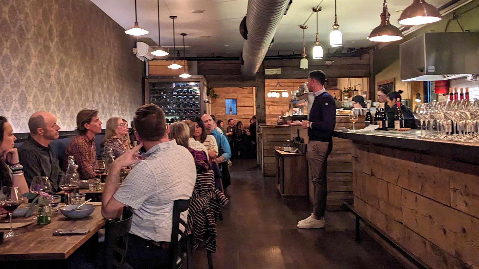 Guests listening to a wine presentation at Spuntino in Denver